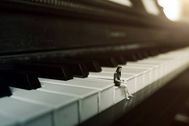 istock Woman on a piano 545814446