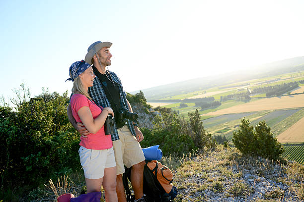 istock young couple backpacker on mountain trek admiring beautiful sunset landscape 545814842