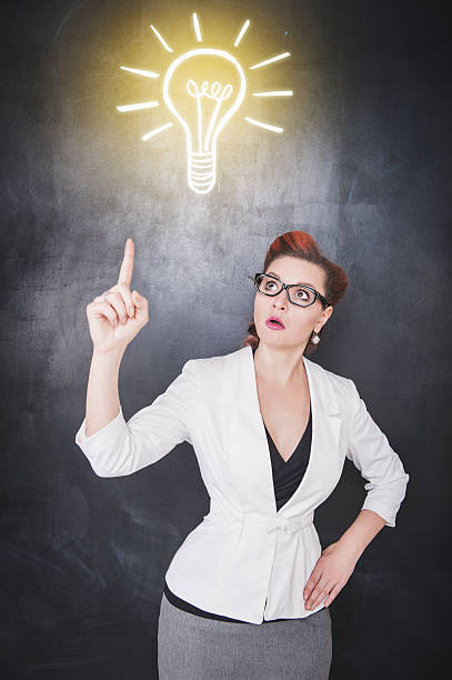 istock Idea concept. Woman showing on drawing lamp 545815894