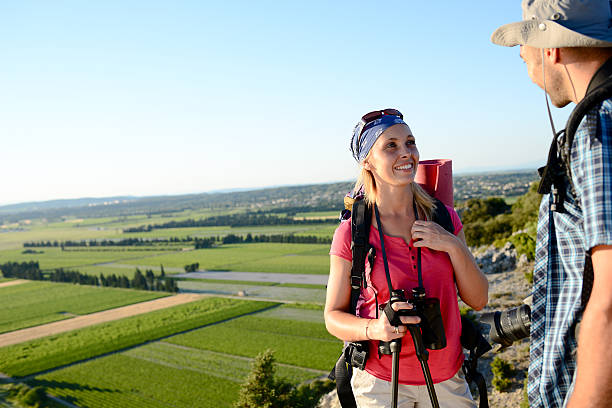 istock young couple hiking together with backpack on adventure trek 545816198