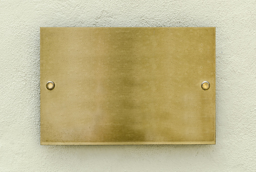 Golden plaque on a wall for your background