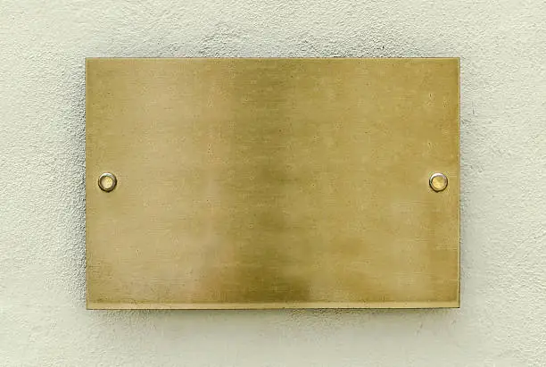 Golden plaque on a wall for your background