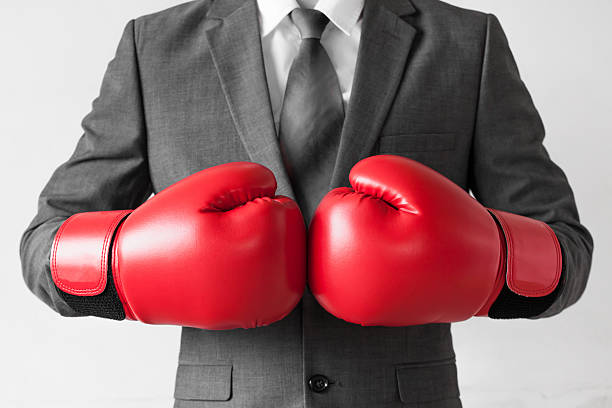 istock Businessman in boxing gloves isolated on white background 545818496