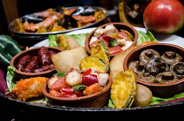 Set of different meals in a bar of tapas Set of different meals in a bar of tapas in Barcelona in a perfect night with friends tapas photos stock pictures, royalty-free photos & images