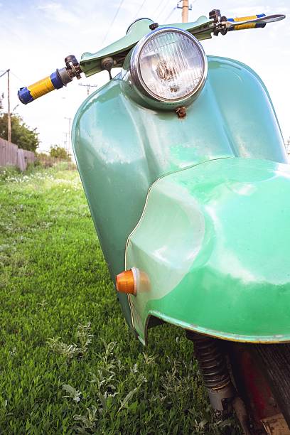 istock Green vintage scooter in grass 545981836