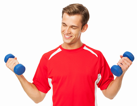 Young fit man exercising with dumbbells over white background. Horizontal shot.