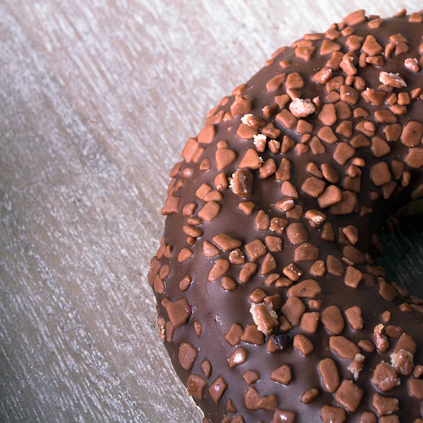 istock donut on wooden background 545983398