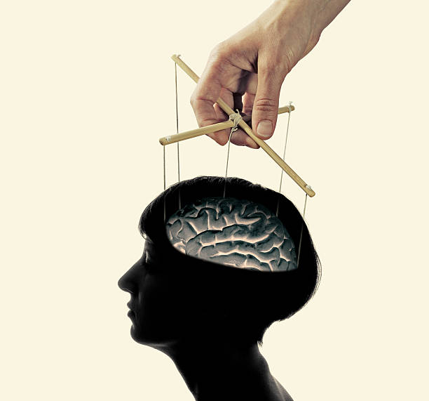 脳をコントロールする - puppeteer ストックフォトと画像