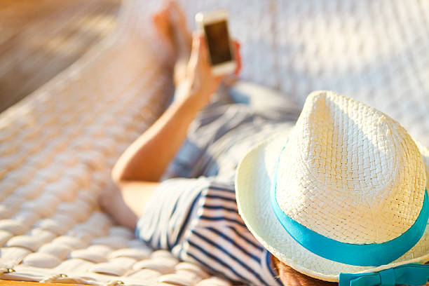 istock Man in hammock with mobile phone on a summer day 545984088