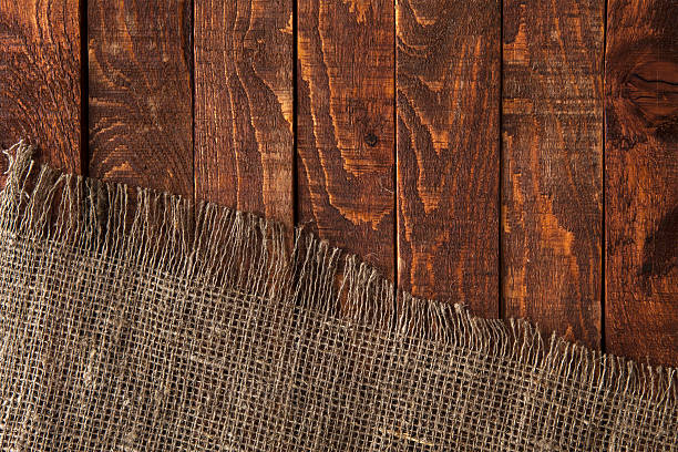 istock Dark wood with old burlap cloth, top view 545984638
