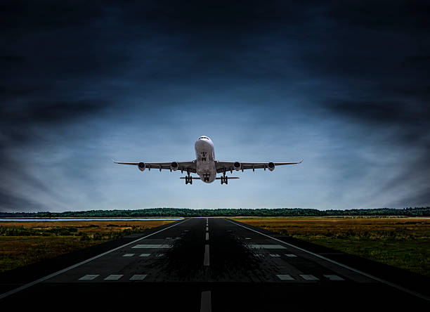 istock Passenger airplane landing at dusk 545985608