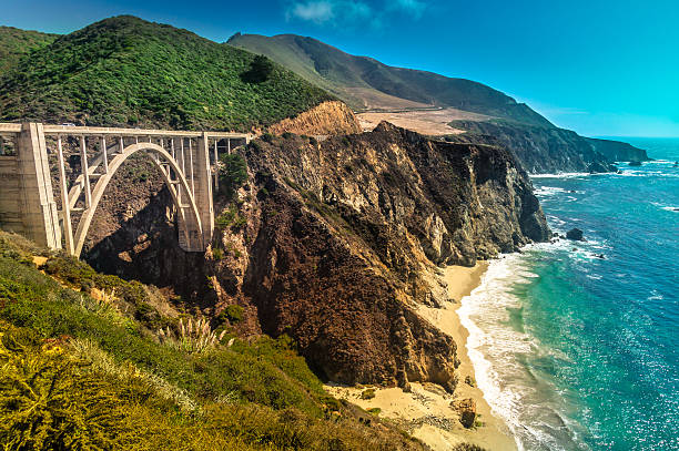 Bixby Creek Bridge on Pacific Coast Highway #1, Los Angeles Bixby Creek Bridge on Pacific Coast Highway #1 at the US West Coast traveling south to Los Angeles, Big Sur Area, California. Picture made during motorcycle roadtrip. city of monterey california stock pictures, royalty-free photos & images