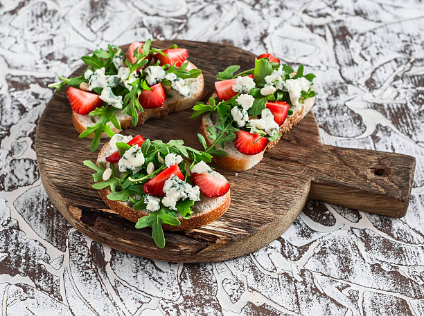 istock Sandwiches with strawberries, arugula and blue cheese 545989980