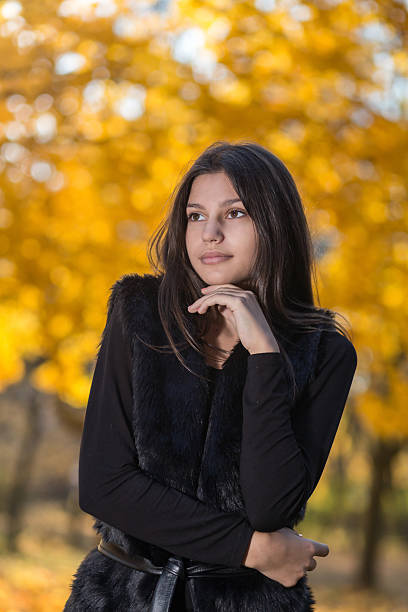 istock Beautiful girl in the park 545990186