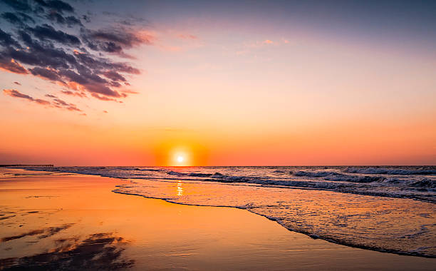 istock Sunrise or sunset colors along the ocean shore 545991636