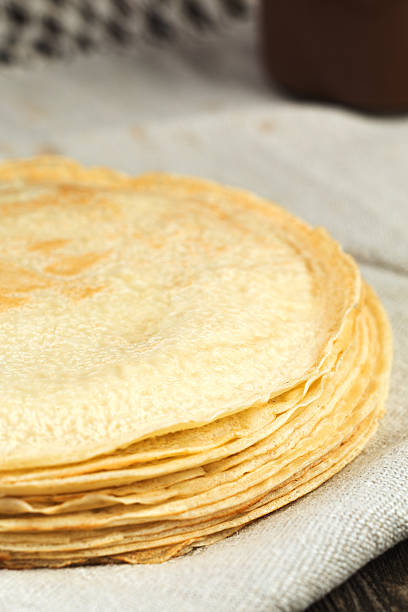 istock Thin russian crepes pancakes on linen towel 545991770