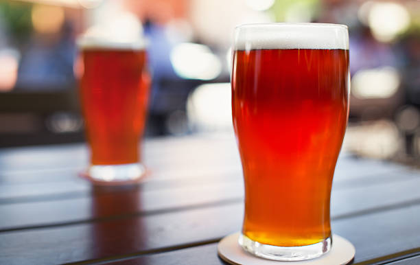 istock Pint glass of craft beer on table 545992026