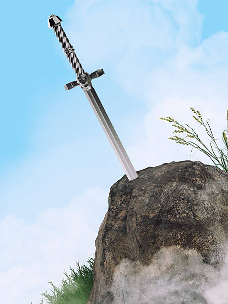 istock sword excalibur King Arthur stuck in the rock stone isolated 545993374