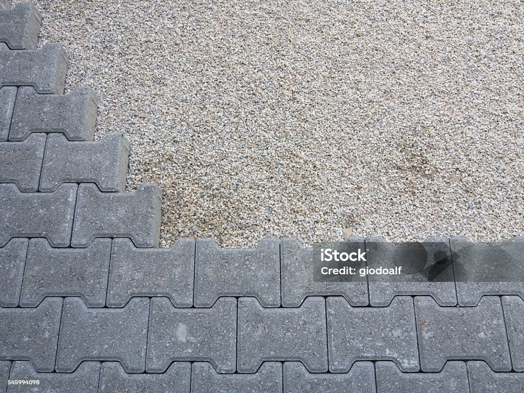 installation of a floor self-locking gray concrete permeable flooring assembled on a substrate of sand Architecture Stock Photo