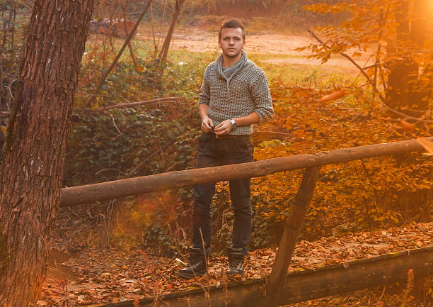 istock Young man on an old wooden bridge 545995012