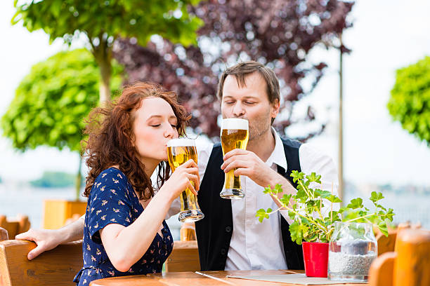 Man and woman drinking in beer garden pub