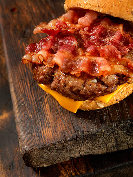 Bacon Cheese Burger Bacon Cheese Burger -Photographed on Hasselblad H3D-39mb Camera bacon cheeseburger stock pictures, royalty-free photos & images