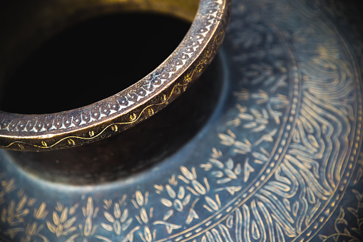 Close-up shot of a vase and its detailed patterns, as seen in Agra, India.