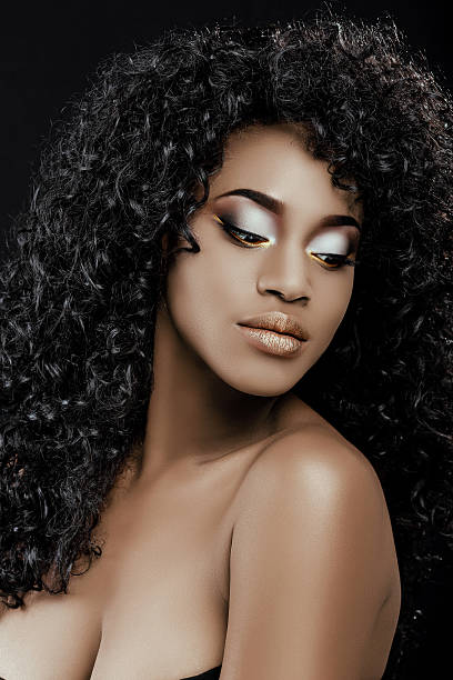 istock Beautiful african woman, posing on the black background 545998344