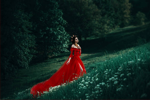 istock Lady in a luxury lush red dress 545999378