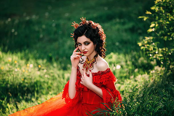 istock Lady in a luxury lush red dress 545999478
