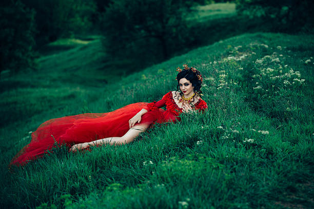 istock Lady in a luxury lush red dress 545999516