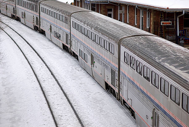 Amtrak's "California Zephyr" Train in Glenwood Springs, CO Glenwood Springs, Colorado, USA - January 5, 2016: View looking down on Amtrak's westbound "California Zephyr" passenger train cars during a stop at the historic Glenwood Springs Amtrak station on a cold, winter afternoon. Amtrak stock pictures, royalty-free photos & images