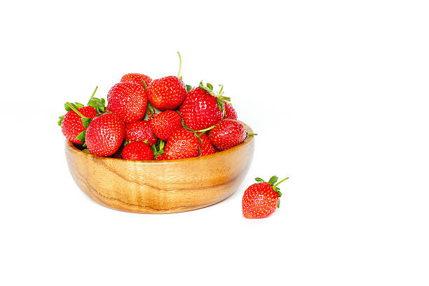 istock Strawberries in a wooden bowl on a white background 546000464