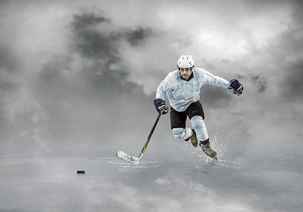 istock Ice hockey player on the ice and light effects 546002768