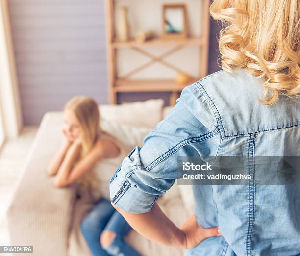 Mom And Daughter Stock Photo - Download Image Now - Child, Discussion, Parent