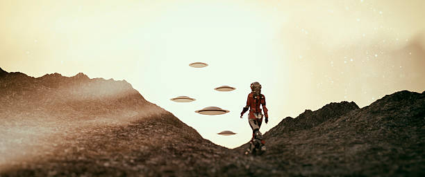 ufo를 향해 걷는 우주비행사 - people exploration futuristic walking 뉴스 사진 이미지