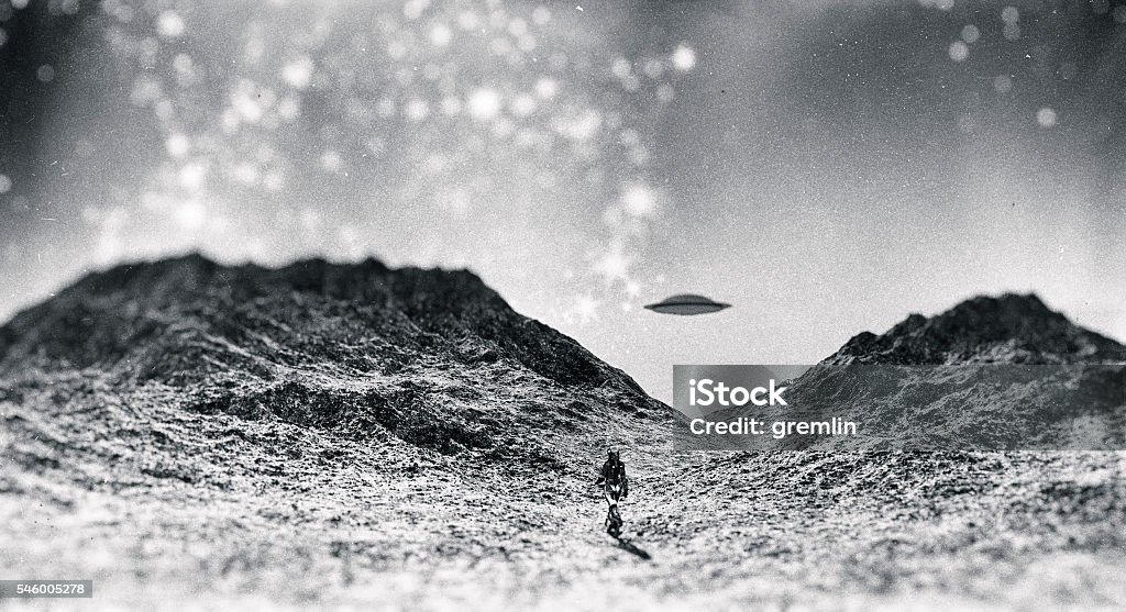 Astronaut walking towards UFO Astronaut walking towards UFO. UFO Stock Photo