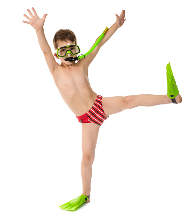 Funny boy in diving mask and flippers, isolated on white