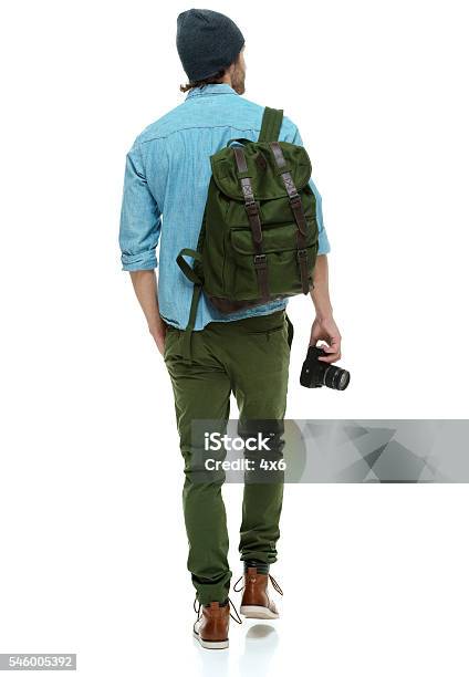 Rear View Of Photographer Walking Stock Photo - Download Image Now - Rear View, Men, Backpack