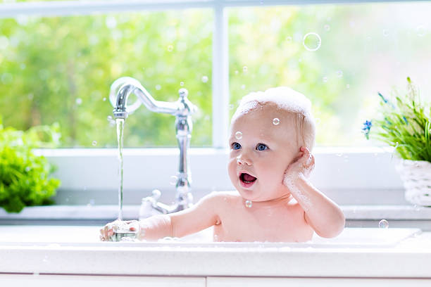 istock Sweet little baby taking bath 546007914