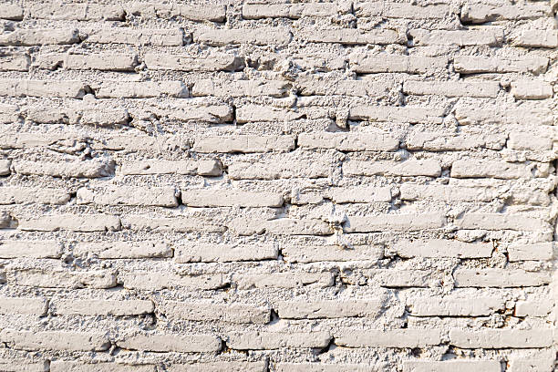 istock Old Vintage white brick cement wall texture background 546011214