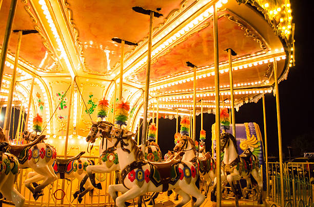 istock merry-go-round at canival at night 546011254