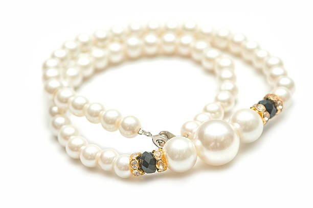 istock Beautiful pearl necklace on white 546011262