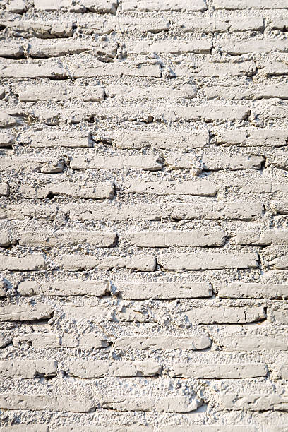 istock Old Vintage white brick cement wall texture background 546011280