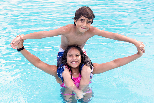 Happy Children playing in a swimming pool