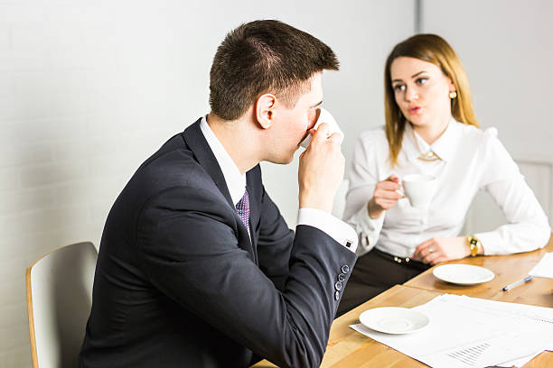 istock Coffee break chat. Group of attractive business people holding a 546018058