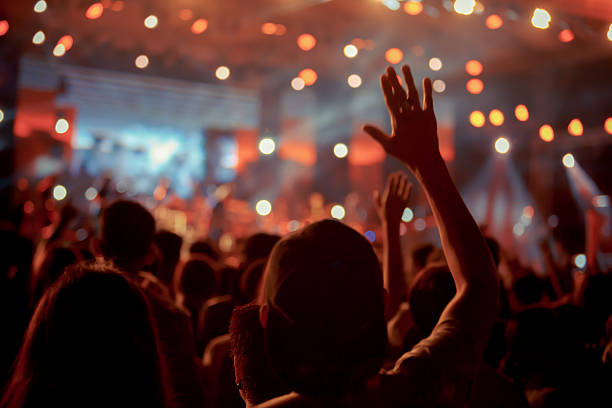 istock Crowd in front of concert stage blurred 546018126