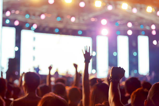 istock Crowd in front of concert stage blurred 546018170