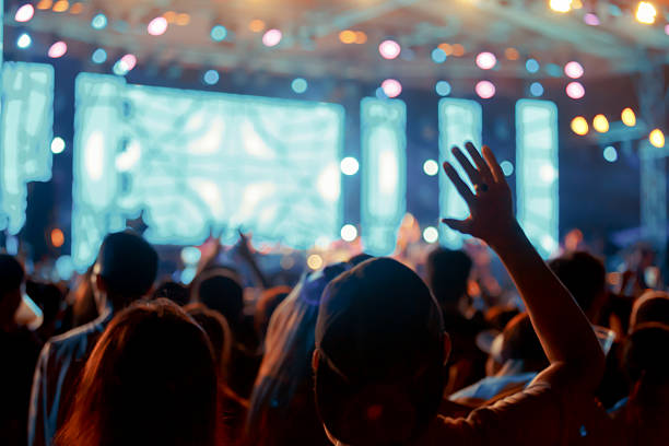 istock Crowd in front of concert stage blurred 546018198
