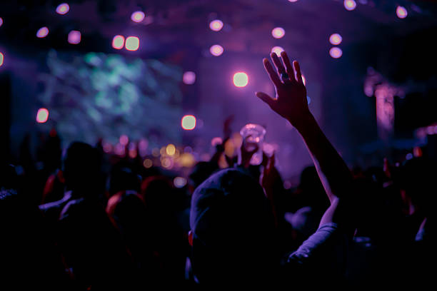 istock Crowd in front of concert stage blurred 546018214